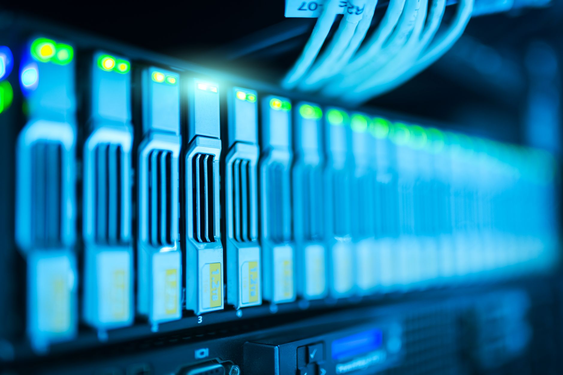 Close-up database server rack cables in blue neon colors